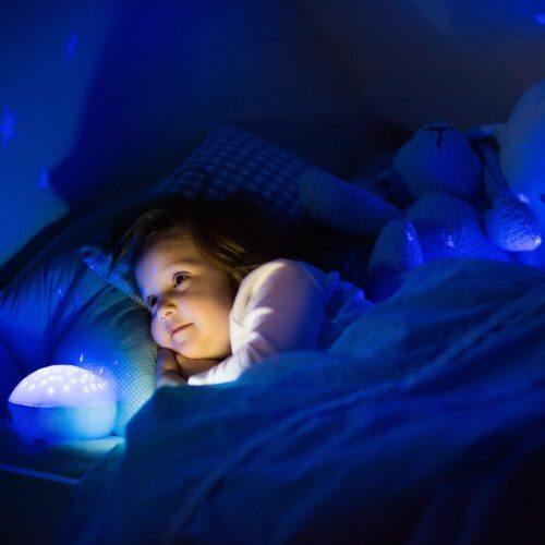 toddler looking at a night light