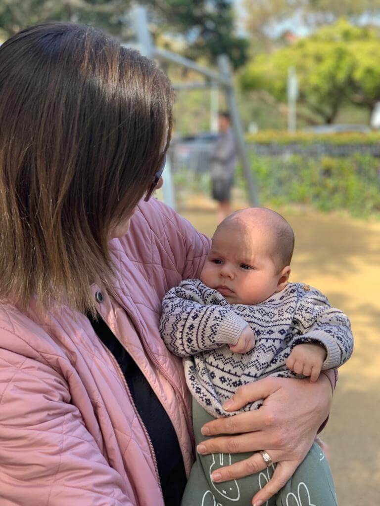 Catherine Thompson holding a 6 month baby