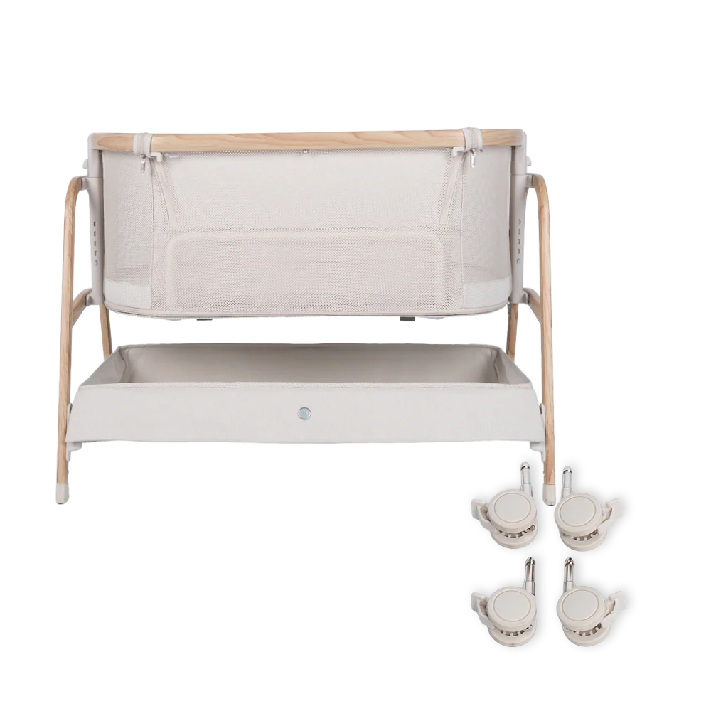 A beige and wood Babybee Pod Bedside Sleeper bassinet with mesh sides, a lower storage shelf, and four detachable caster wheels is placed on the right side of the image.