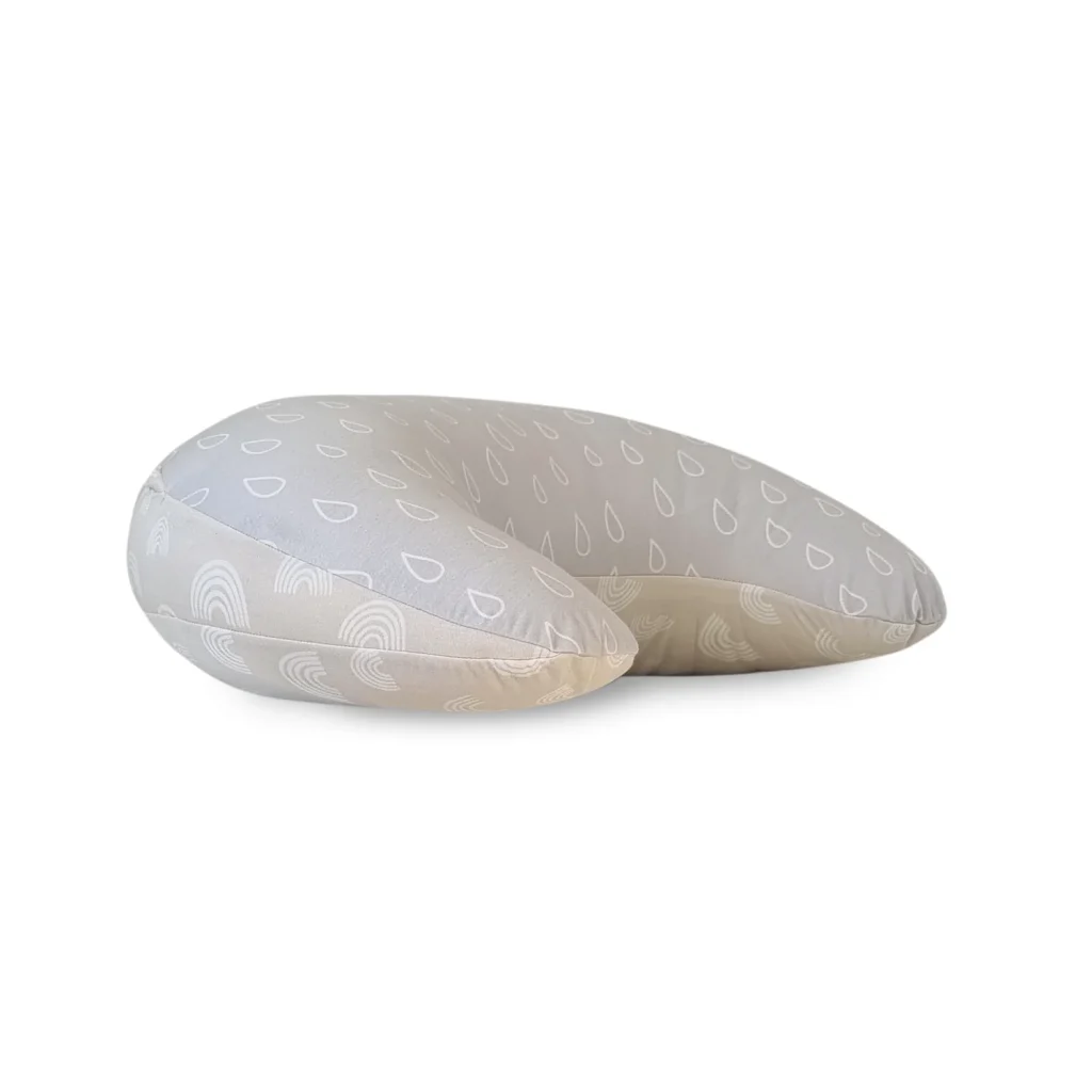 A light gray U-shaped pillow with white raindrop and rainbow patterns, designed for neck or head support, is featured on a white background—perfect for those seeking a Bubba Blue Nordic Air+ Nursing Pillow review.